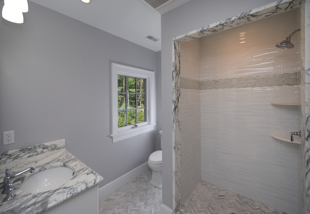 77 Autumn Road Weston, MA 02493 - Photo 22 of 24 a bathroom with a granite countertop sink a toilet and shower