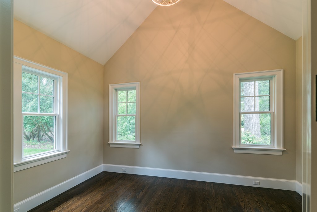 77 Autumn Road Weston, MA 02493 - Photo 23 of 24 a view of an empty room with wooden floor and a window