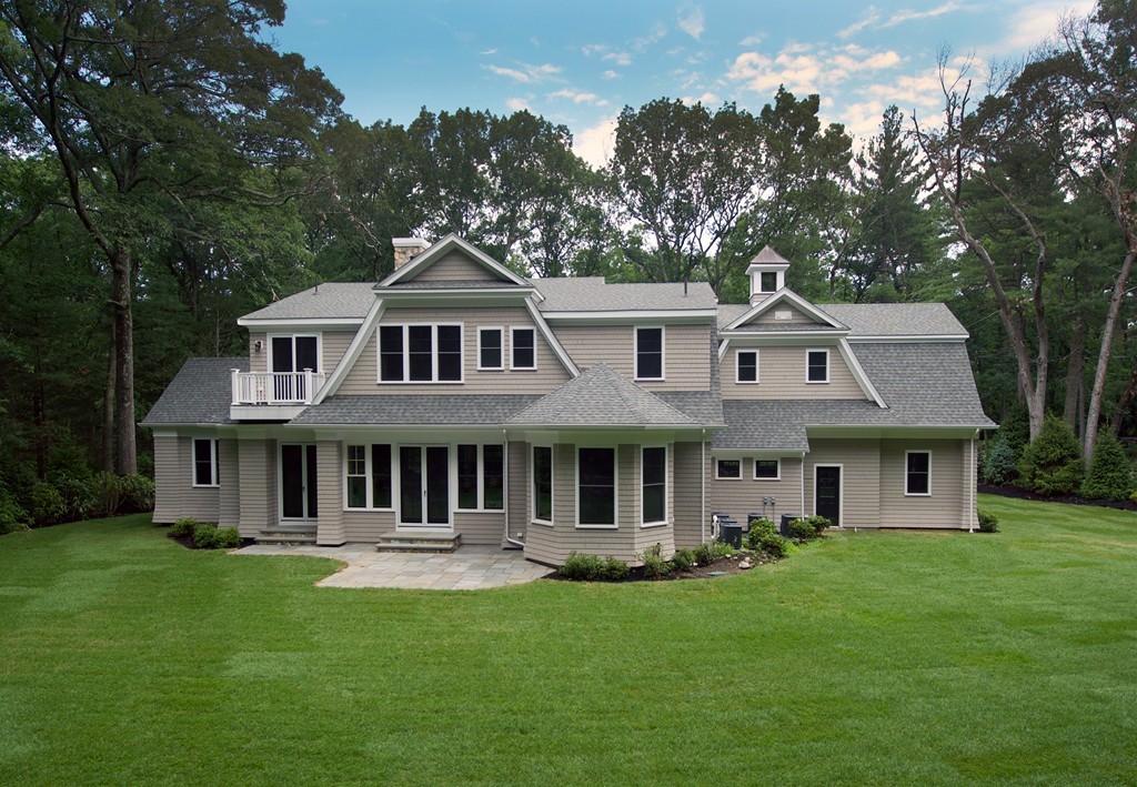 77 Autumn Road Weston, MA 02493 - Photo 3 of 24 a front view of a house with a garden