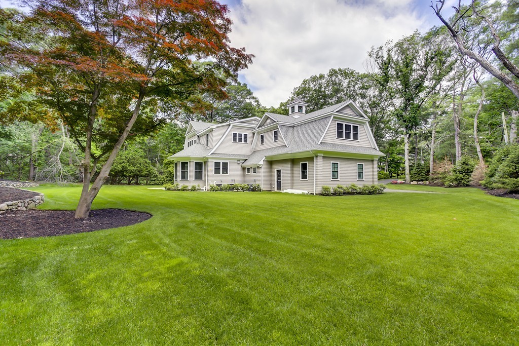 77 Autumn Road Weston, MA 02493 - Photo 5 of 24 a front view of a house with a yard