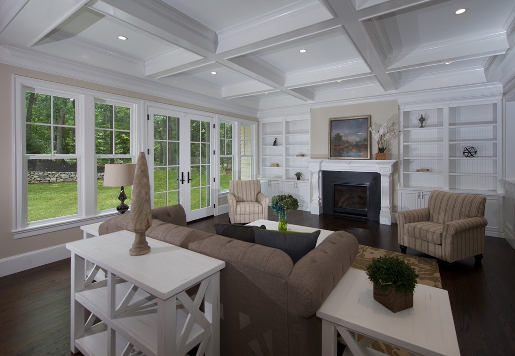 77 Autumn Road Weston, MA 02493 - Photo 10 of 24 a living room with furniture a fireplace and a large window