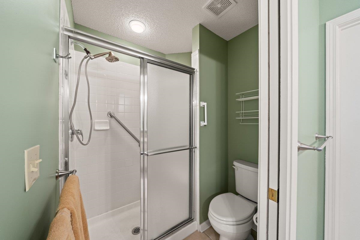 1102 Oak Heights Lane, Unit 93 Collierville, TN 38017 - Photo 21 of 30 a bathroom with a glass shower door