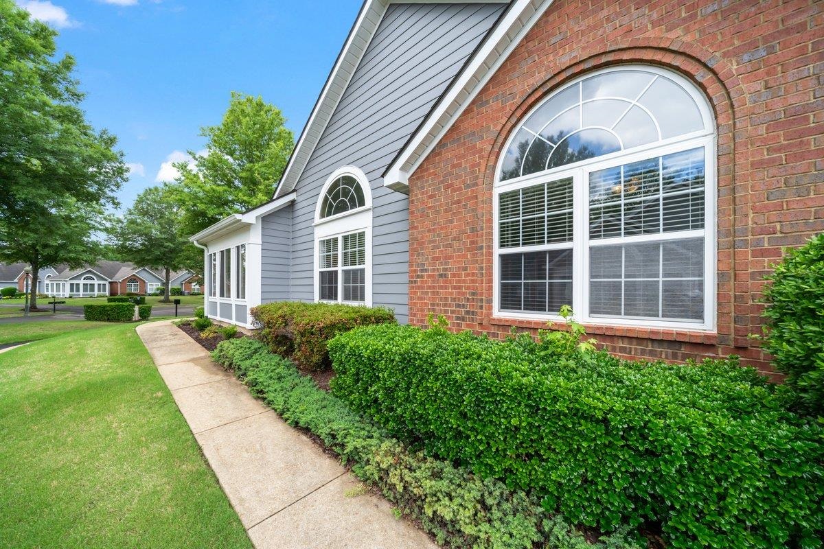 1102 Oak Heights Lane, Unit 93 Collierville, TN 38017 - Photo 5 of 30 a front view of a house with garden