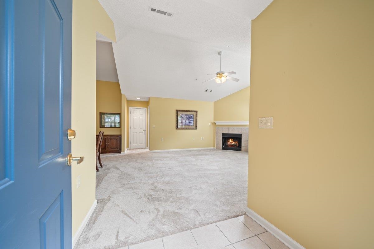 1102 Oak Heights Lane, Unit 93 Collierville, TN 38017 - Photo 7 of 30 a view of an empty room with a fireplace