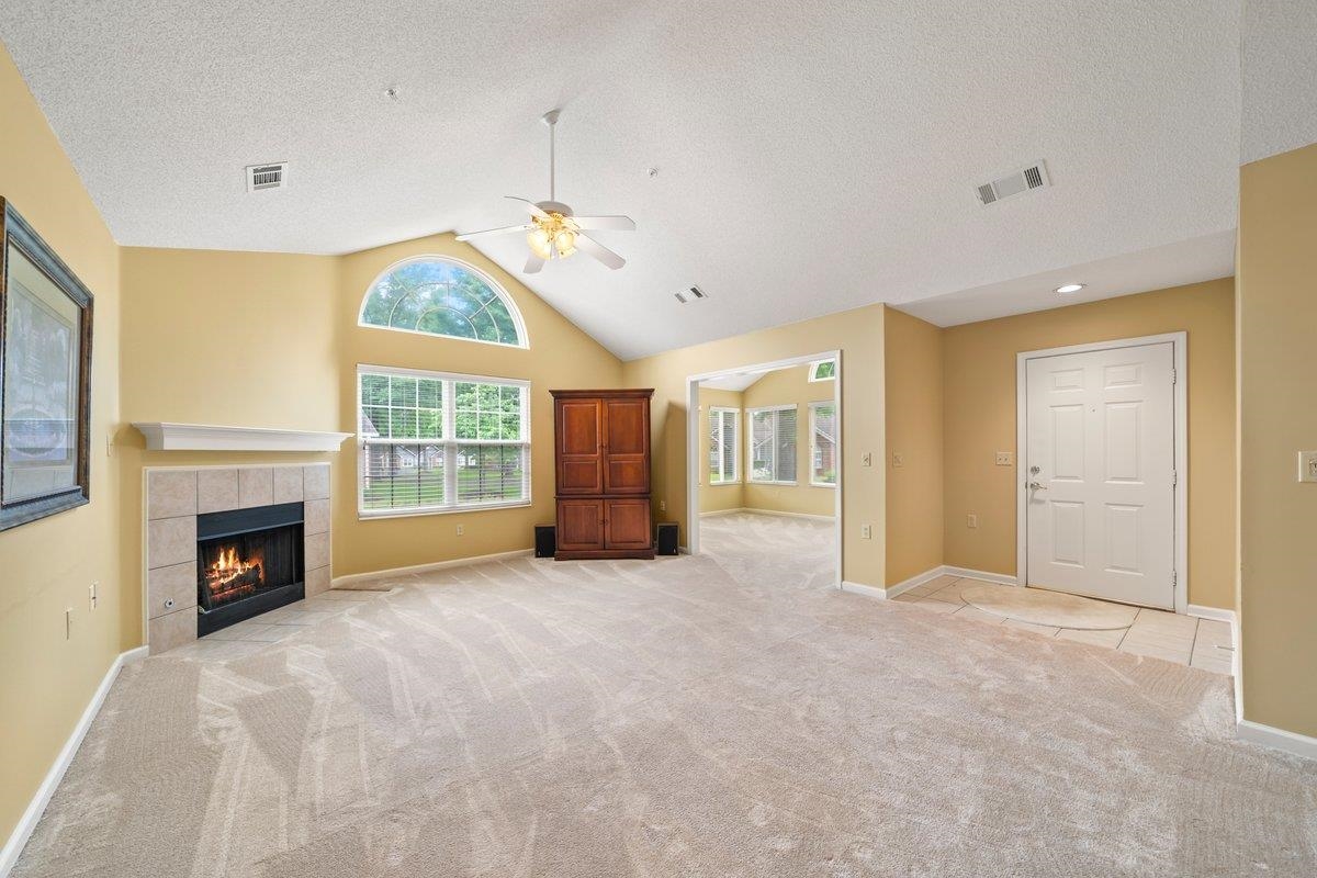 1102 Oak Heights Lane, Unit 93 Collierville, TN 38017 - Photo 10 of 30 a view of an empty room with a fireplace and a window