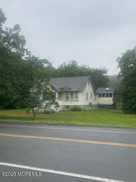 2430-2438 Church Road Toms River, NJ 08753 - Photo 2 of 3 a front view of a house with a yard and trees