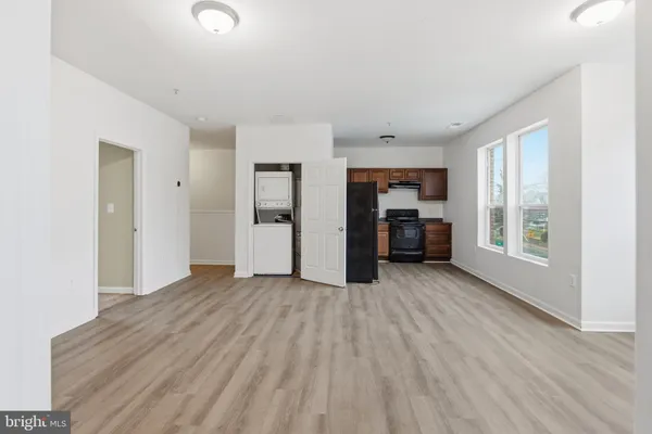 a big room with closet and windows