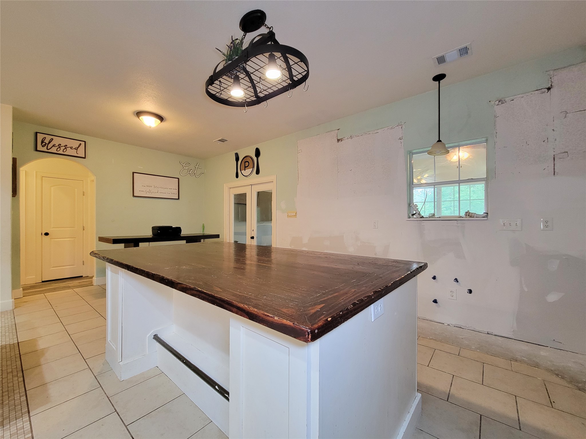2011 Old Ox Road Spring, TX 77386 - Photo 21 of 38 a kitchen with stainless steel appliances granite countertop a sink a microwave a stove and white cabinets