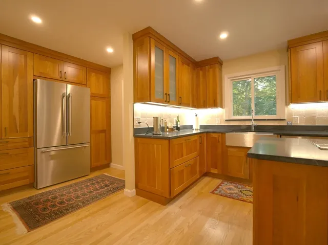 a spacious bedroom with a bed and a window