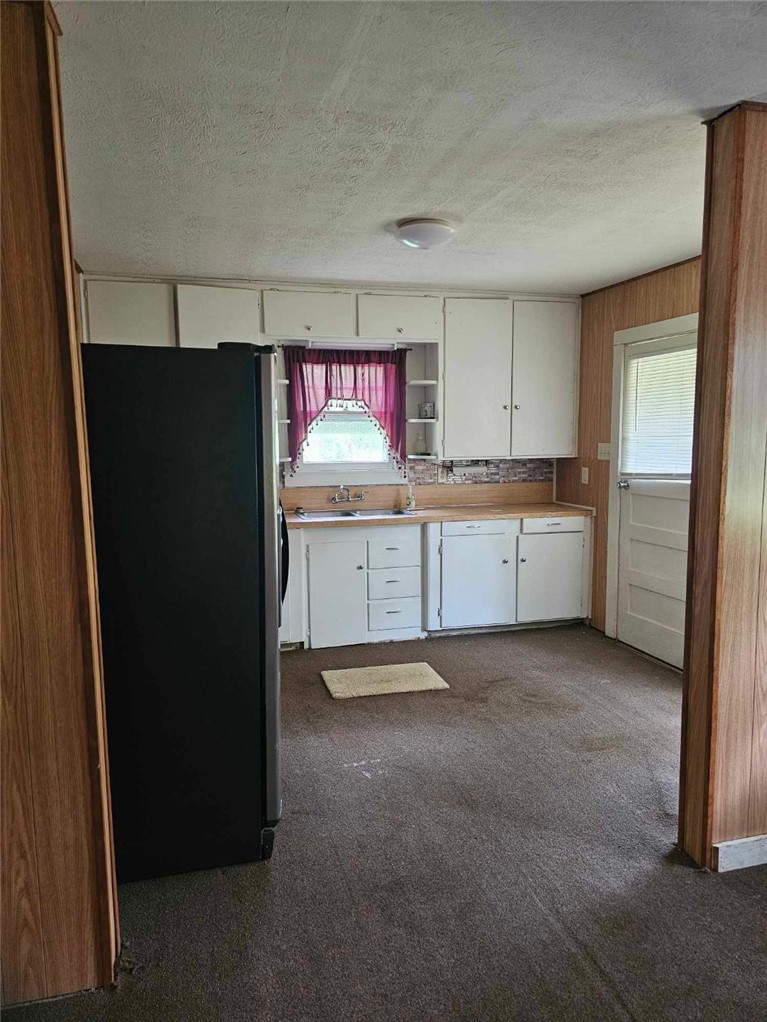3961 Counts Road Point Blank, TX 77364 - Photo 8 of 9 a view of kitchen with refrigerator stove and window