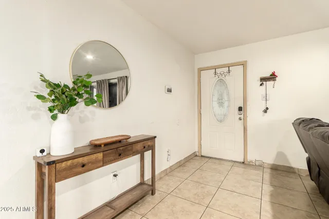 a kitchen with granite countertop a stove a sink and a refrigerator
