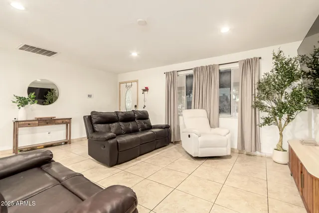 a view of a dining room with furniture and a kitchen
