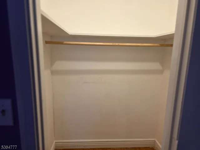 a view of front door with wooden floor