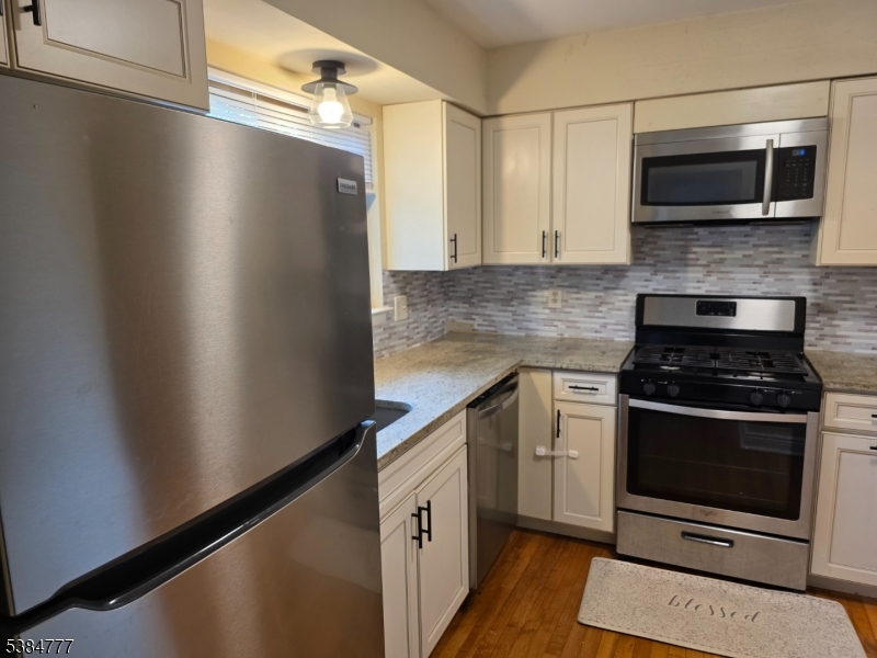 3 Chestnut Court High Bridge, NJ 08829 - Photo 2 of 31 a kitchen with stainless steel appliances a refrigerator a stove top oven a sink and a granite counter tops
