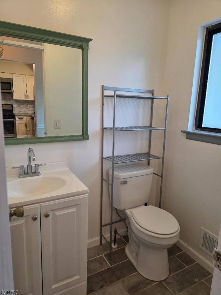 3 Chestnut Court High Bridge, NJ 08829 - Photo 9 of 31 a bathroom with a toilet a sink and mirror