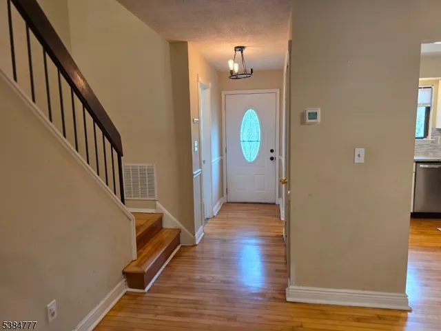 a view of a livingroom from a corridor