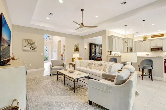 a dining room with furniture and a window