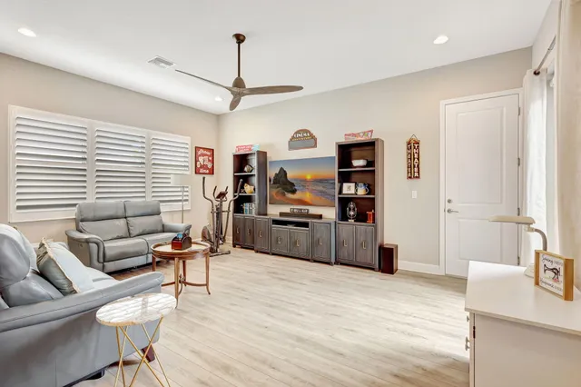 a bathroom with a granite countertop toilet sink and mirror