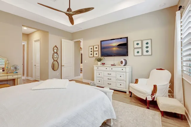 an aerial view of a house with swimming pool and outdoor seating