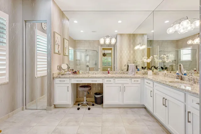 a room with pool table and windows