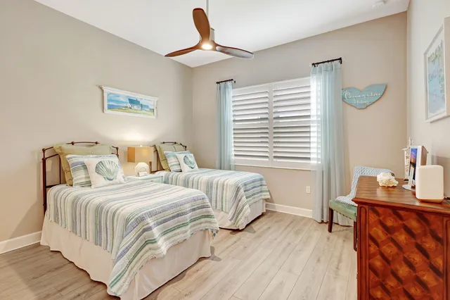 a view of a dining room with furniture and a chandelier