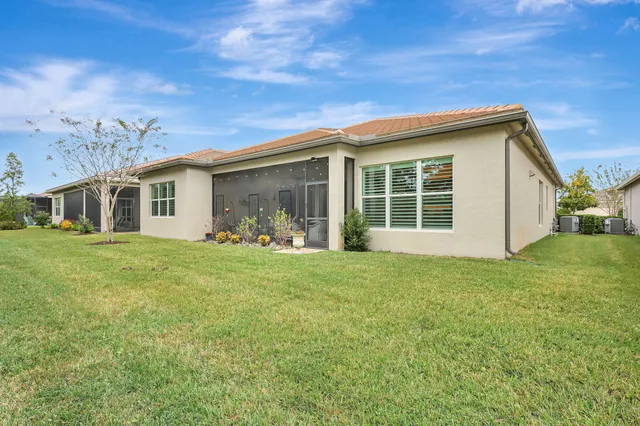 a view of a dining room with furniture and window