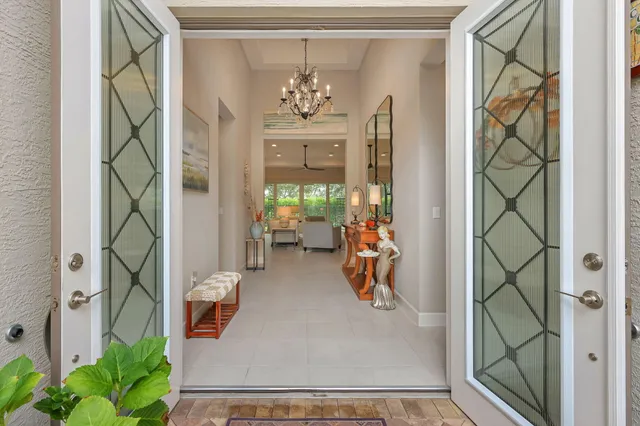 a view of a dining room with furniture large window and wooden floor