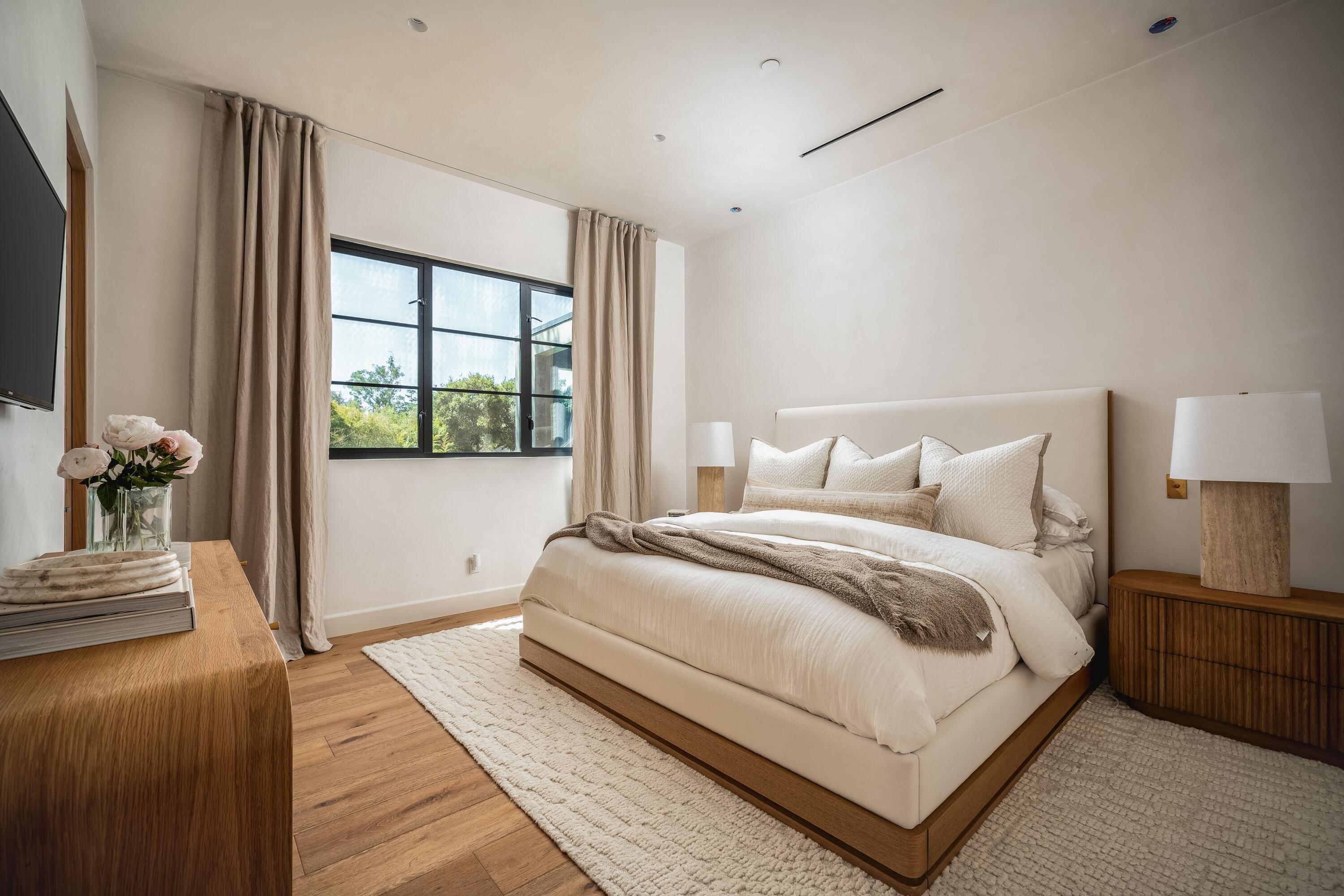 2775 Sycamore Canyon Road Montecito, CA 93108 - Photo 11 of 33 a bedroom with a bed and a large window