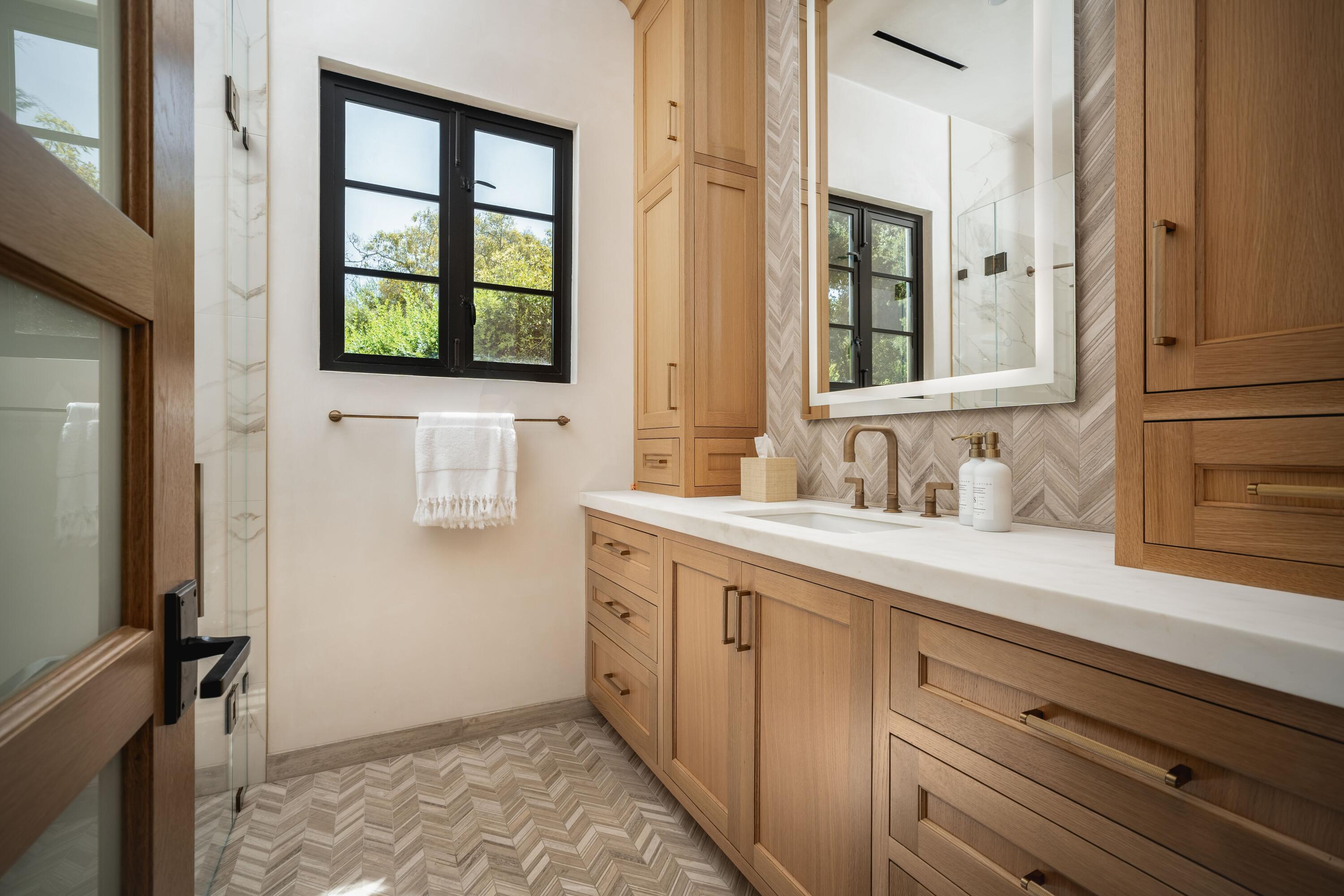 2775 Sycamore Canyon Road Montecito, CA 93108 - Photo 12 of 33 a spacious bathroom with a sink and a window