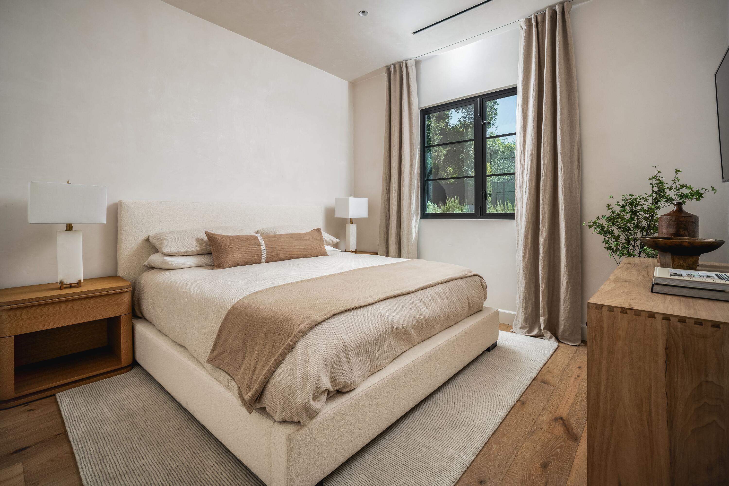 2775 Sycamore Canyon Road Montecito, CA 93108 - Photo 13 of 33 a bedroom with a large bed and a potted plant