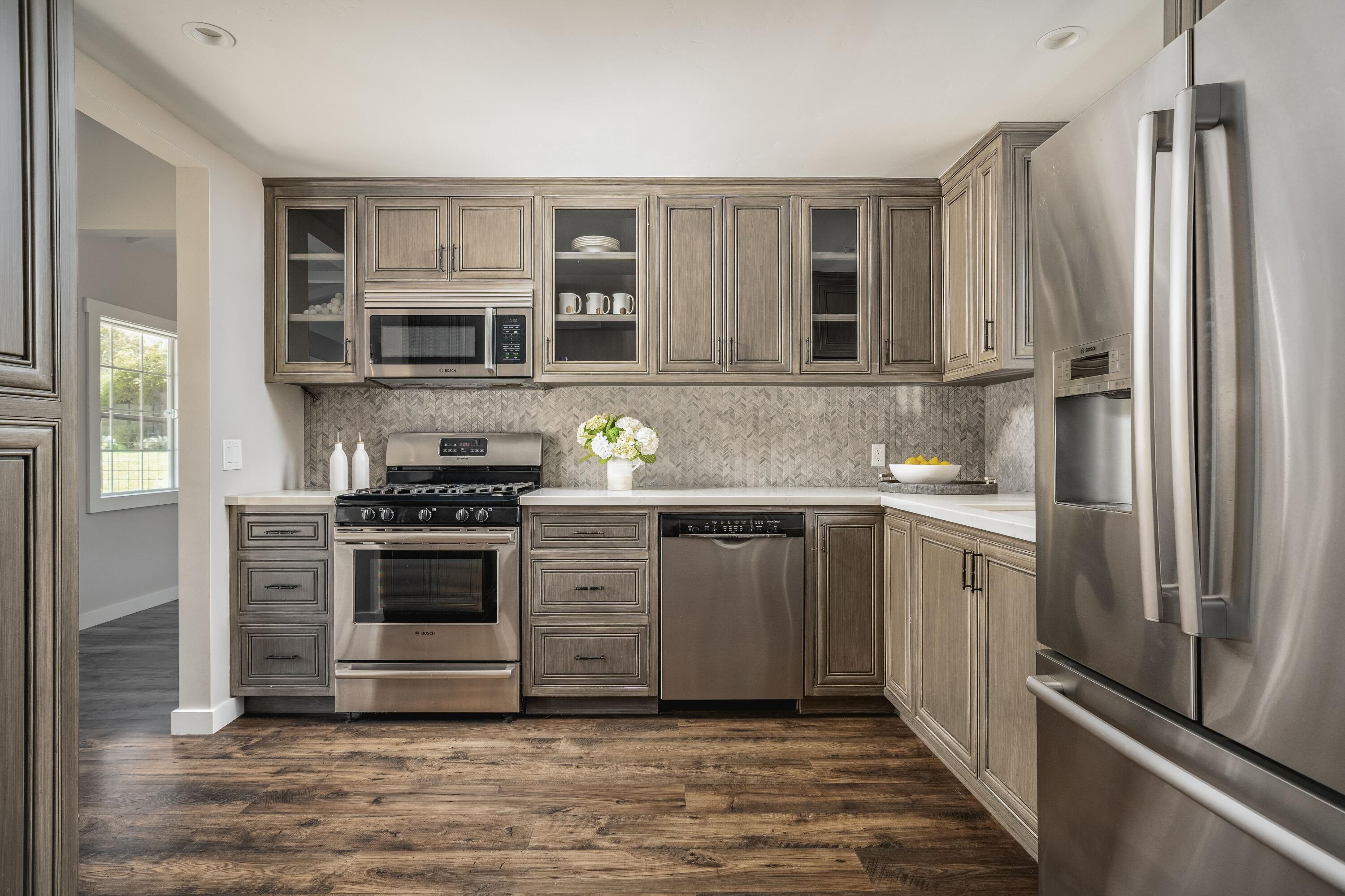 2775 Sycamore Canyon Road Montecito, CA 93108 - Photo 19 of 33 a kitchen with stainless steel appliances granite countertop a refrigerator and a stove