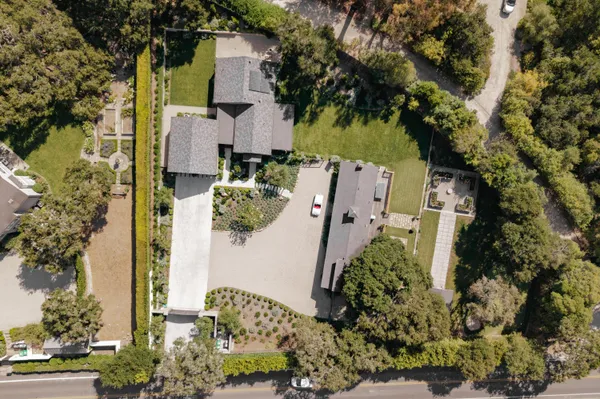 an aerial view of residential houses with outdoor space
