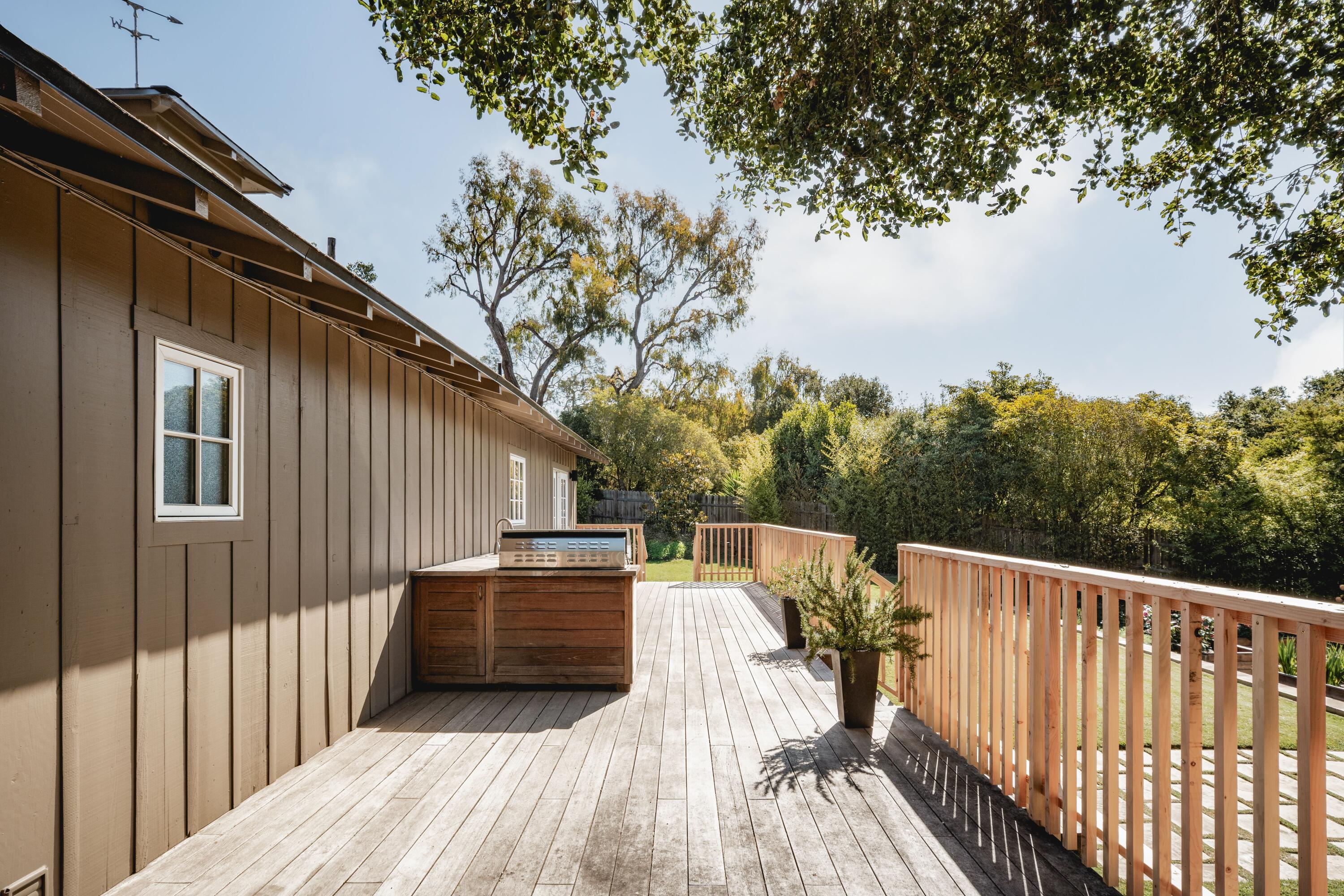 2775 Sycamore Canyon Road Montecito, CA 93108 - Photo 25 of 33 a view of deck with wooden floor and fence with a barbeque