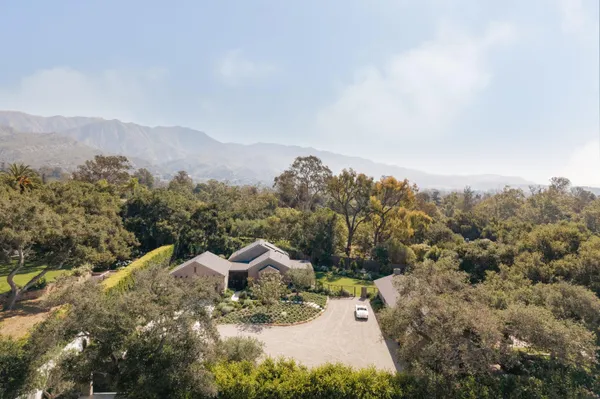 a view of a town with mountains in the background