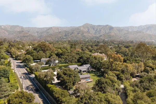 an aerial view of residential house and green space