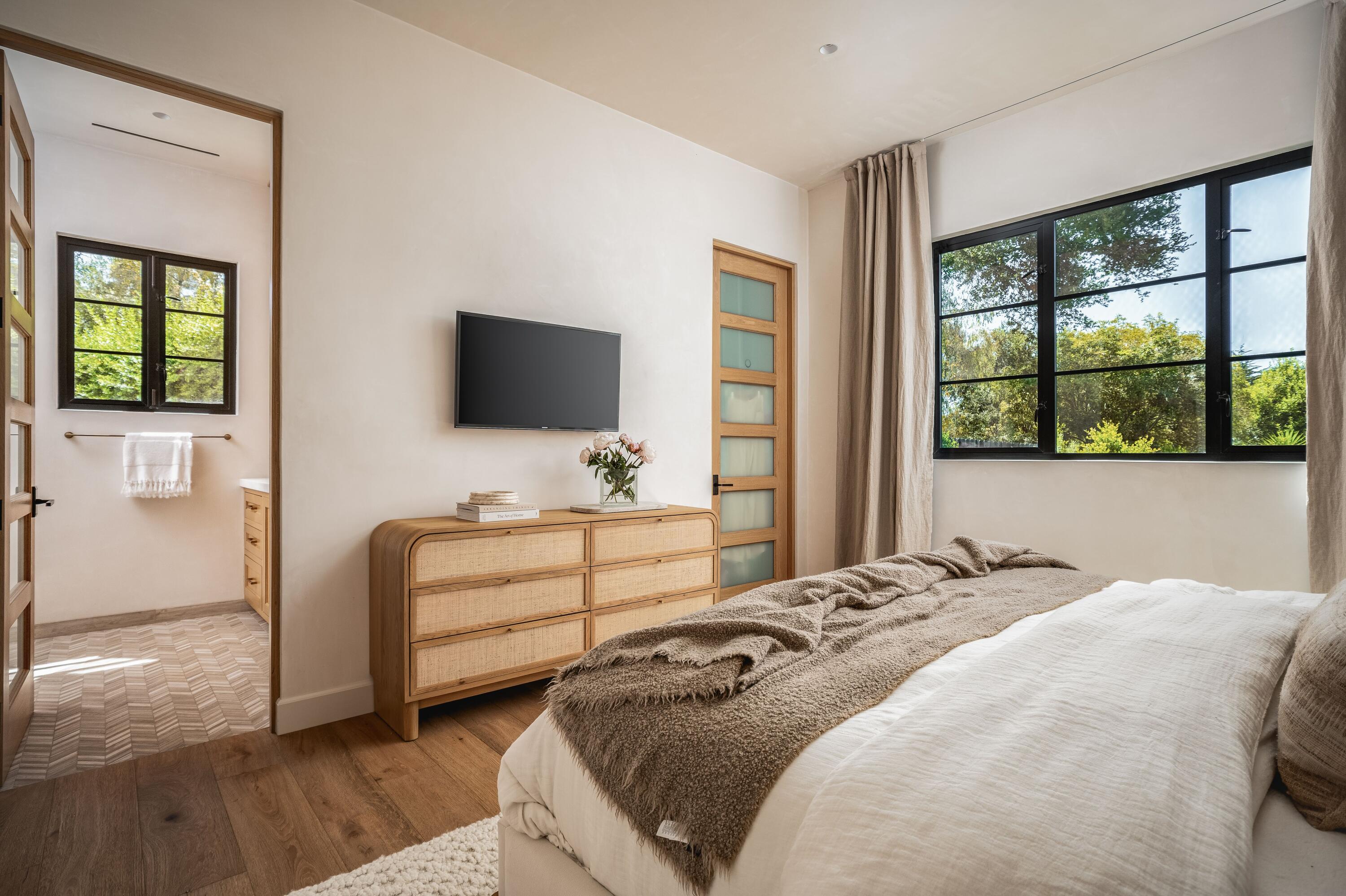 2775 Sycamore Canyon Road Montecito, CA 93108 - Photo 10 of 33 a bedroom with a bed and a flat screen tv