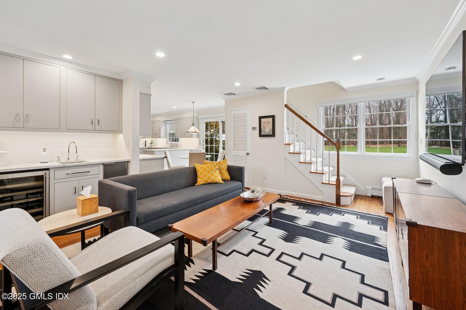 6 Pilgrim Road Darien, CT 06820 - Photo 11 of 23 a living room with furniture and a wooden floor