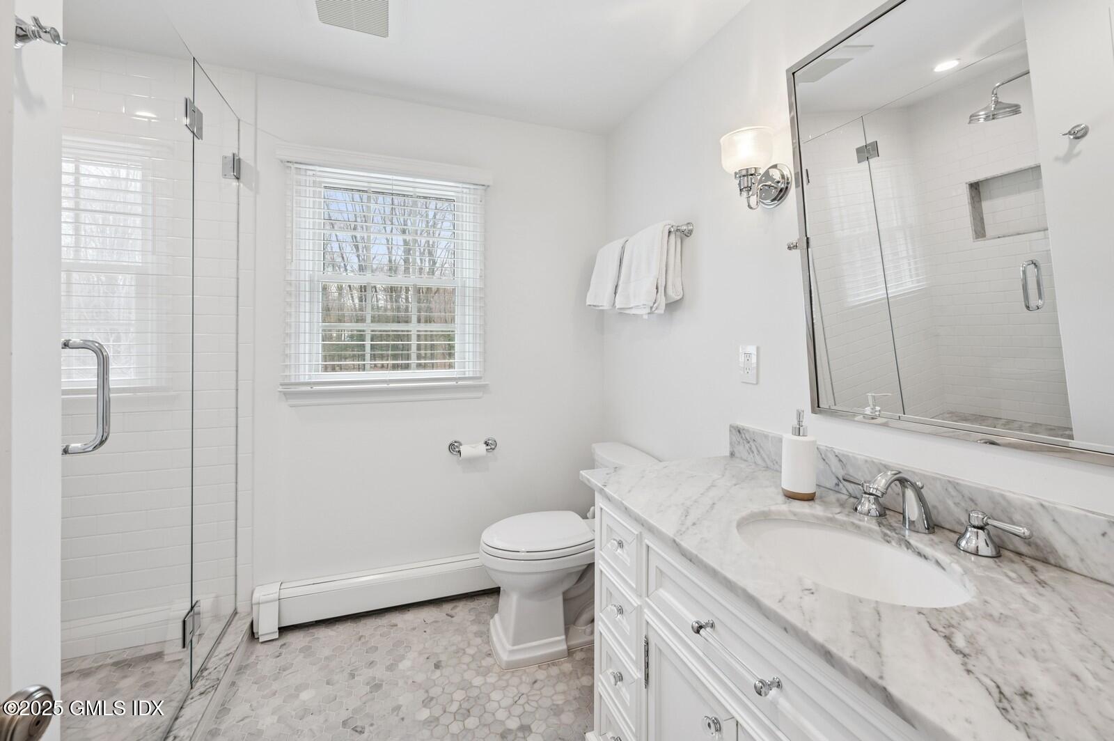 6 Pilgrim Road Darien, CT 06820 - Photo 13 of 23 a bathroom with a granite countertop sink toilet and shower