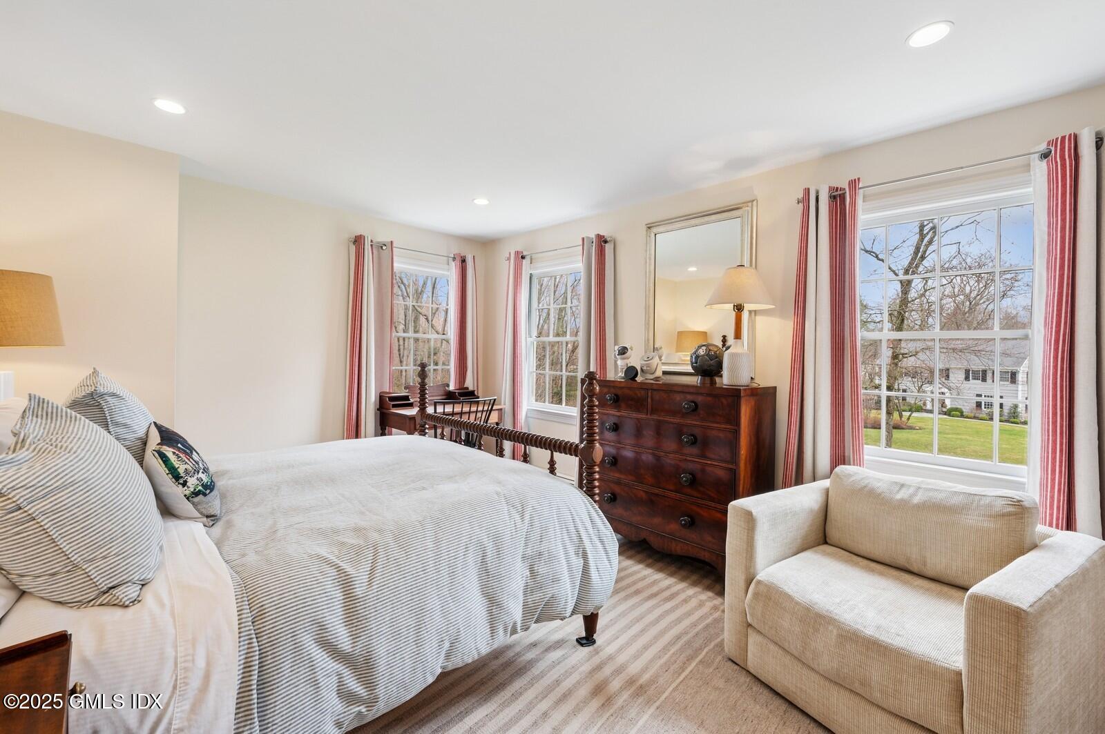 6 Pilgrim Road Darien, CT 06820 - Photo 14 of 23 a bedroom with a bed and glass windows