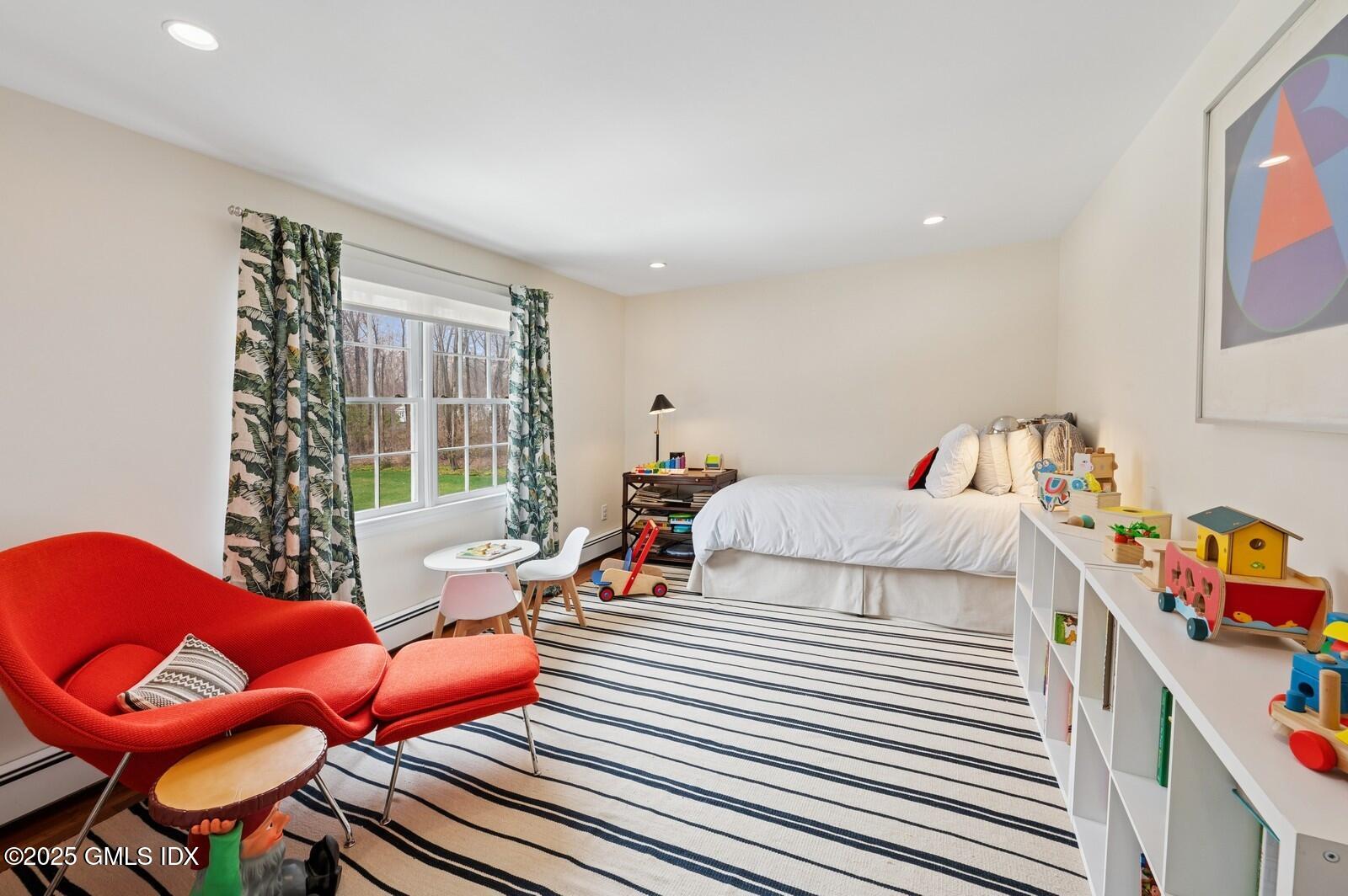 6 Pilgrim Road Darien, CT 06820 - Photo 15 of 23 a bedroom with furniture and a window