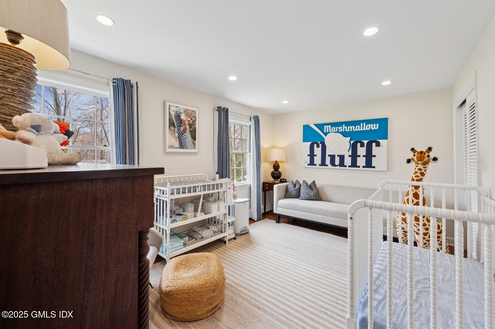 6 Pilgrim Road Darien, CT 06820 - Photo 16 of 23 a living room with furniture and a painting on the wall