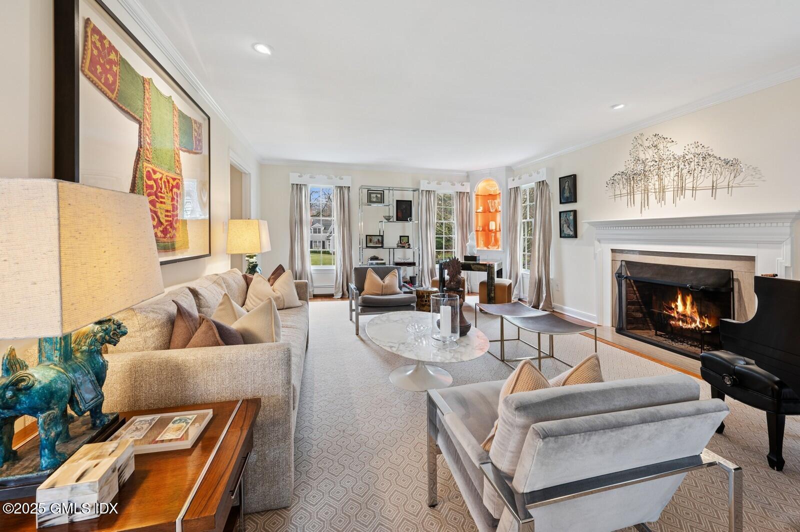 6 Pilgrim Road Darien, CT 06820 - Photo 3 of 23 a living room with furniture and a fireplace