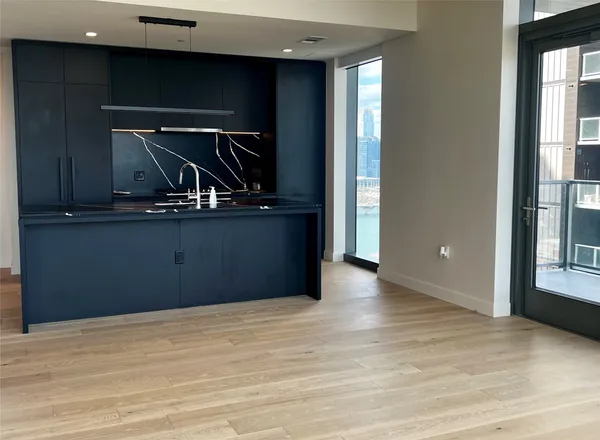 a view of room and wooden floor