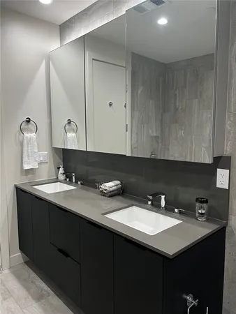 a bathroom with a sink and a mirror