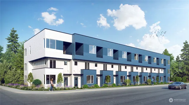 a front view of a building with street view and trees