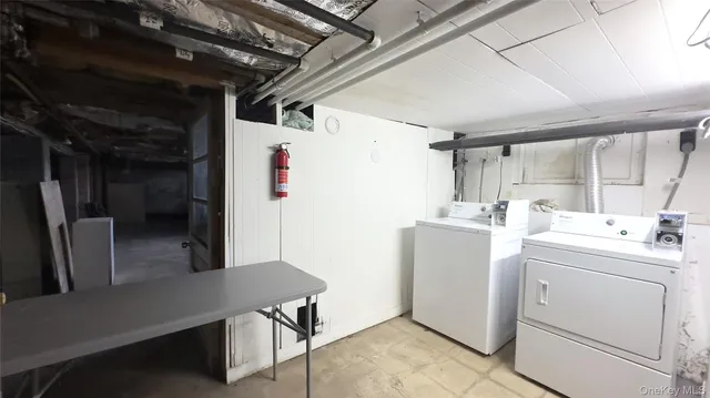 a view of storage and utility room with washer and dryer