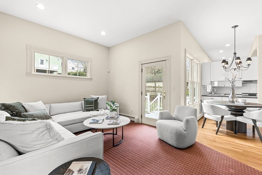 207 Weston Road Wellesley, MA 02482 - Photo 13 of 23 a living room with furniture and a chandelier