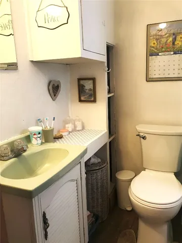 a bathroom with a toilet and a bath tub