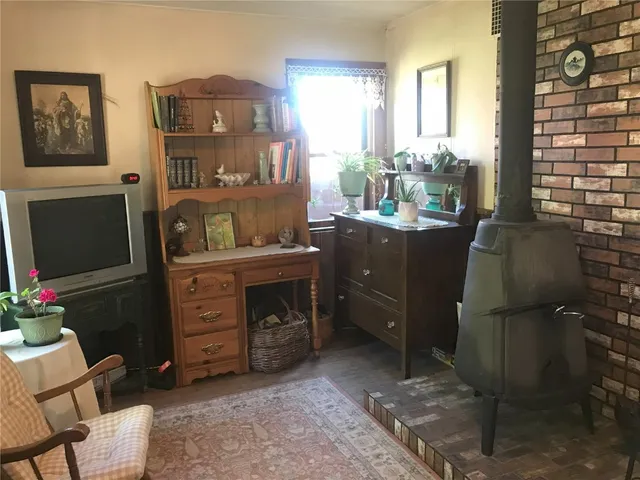 a room with furniture and a flat screen tv