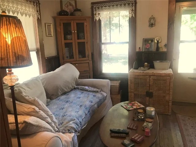 a bedroom with two beds and a window